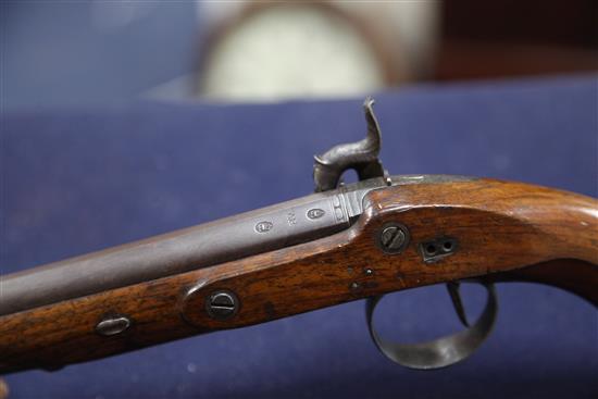 A pair of early 19th century percussion lock pistols, by Wogdon of London, 14in.